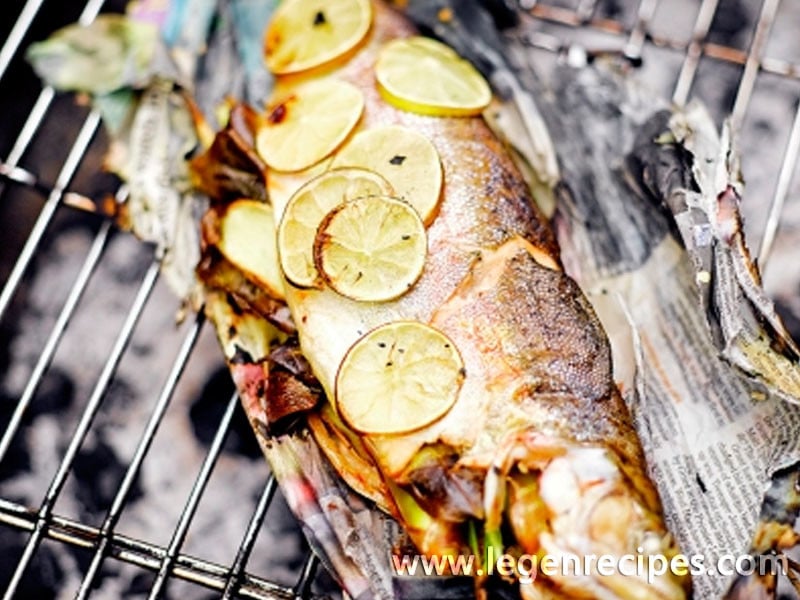 Barbecued trout in newspaper